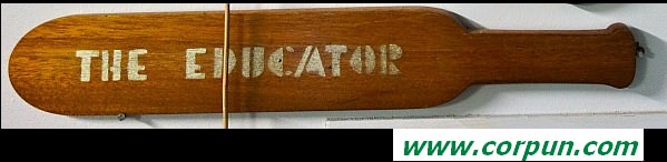 Wood paddle embossed with 'THE EDUCATOR'