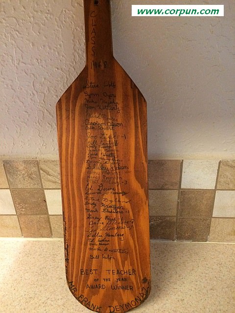 The wooden paddle with names on it
