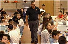 Principal Miguel Salazar with students