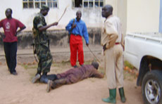Captured prisoner being caned