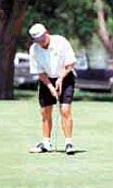 Paddling principal Doug Burke playing golf in 1999