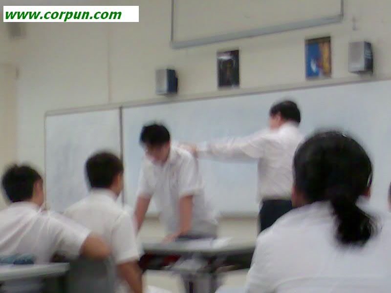 Student about to be caned in front of class